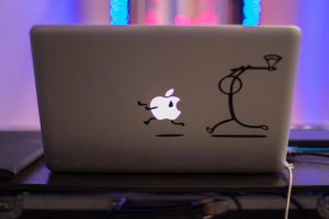 funny illustration of someone attacking a mac