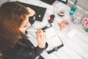 woman planning with notebook